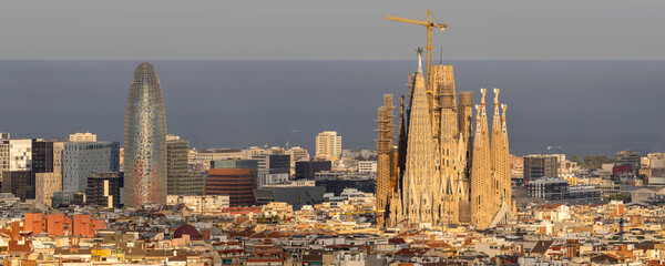 Tele view on Torre Glòries and Sagrada Familia in Barcelona, Spain, from Parque del Turó del...