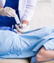 Female patient getting an injection in the clinic