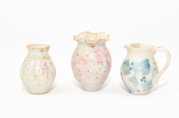 Colorful ceramics clay pots isolated on white background