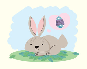 Obraz na płótnie Canvas rabbit lying with spring egg