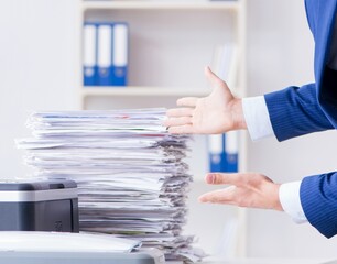 Businessman making copies in copying machine