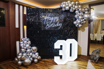 inscription Happy Birthday is made of LED and lamp in the shape of number 30