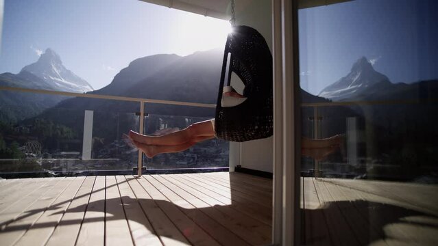 Female relaxing sunset Zermatt vacation home Matterhorn view