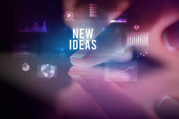 Finger touching tablet with business graphs and icons concept