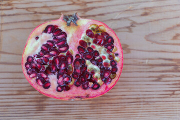 Luscious Pomegranate Cut in Half on a Wooden Surface