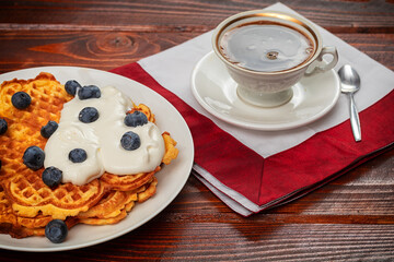 cup of coffee on wooden table.