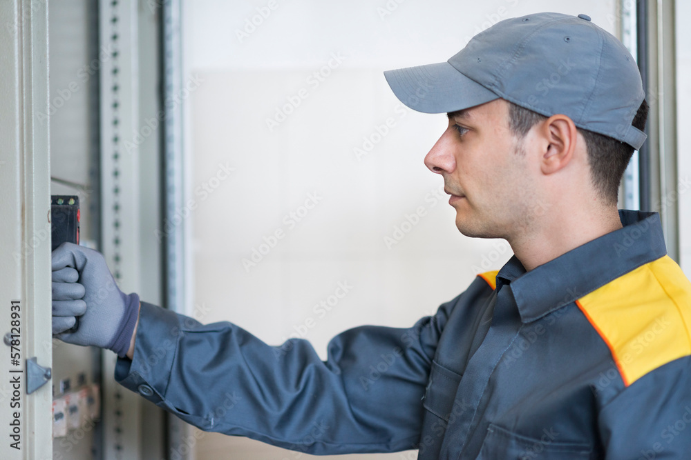 Poster Portrait of an electrician at work