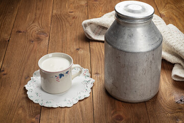 homemade cookies and cup of milk on wooden table