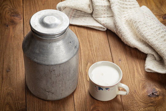 cup of milk on wooden table