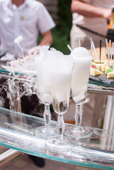 champagne and dry ice at the celebration of the wedding guests table buffet party