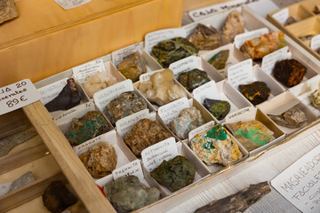 Variety of mineral speciments on counter in souvenir shop with descriptions in Spanish language on...