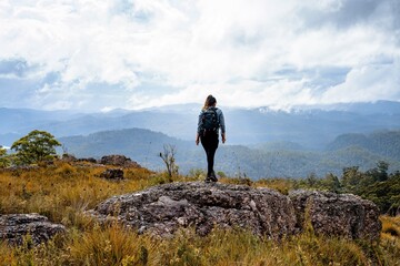 Obraz premium girl on the top of mountain