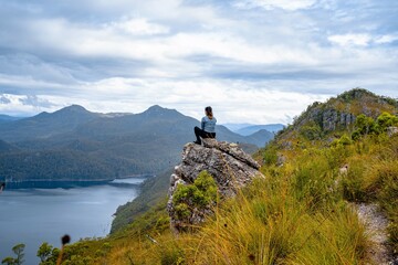 Sitting on a rock in the mountains