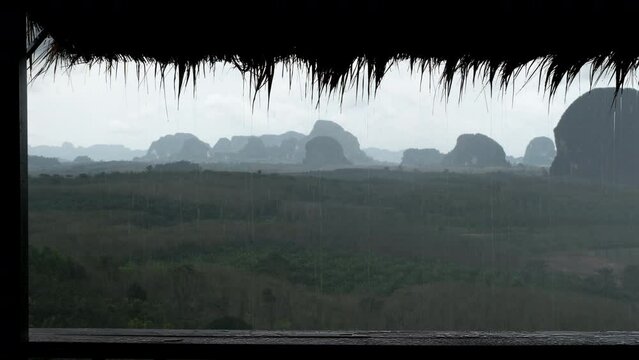 Tripod footage of karst rocks at rain. Din Daeng Doi viewpoint, Krabi Province, Thailand.