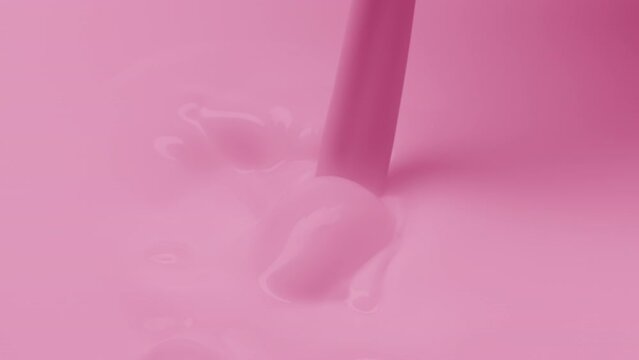 Macro jib shot of pale pink opaque liquid is poured splashing and creating bubbles on pale pink background | Skin care cosmetics with dairy products commercial