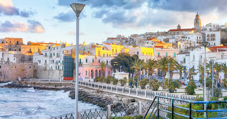 Marvelous  view of historic center and promenade of the city of Vieste at sunset
