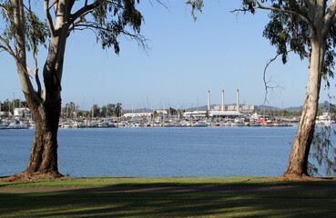 Fototapeta premium View of boats at the Gladstone Marina with the Power Station in the background in Queensland, Australia