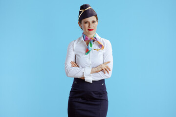 elegant air hostess woman on blue in uniform