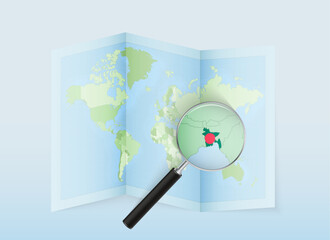 A folded world map with a magnifying lens pointing towards Bangladesh. Map and flag of Italy in loupe.