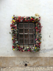 Fototapeta na wymiar Window in flowers. Obidos.,Portugal