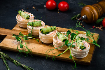 Tartlets with curd cream, crab sticks, cucumber and microgreens. © smspsy
