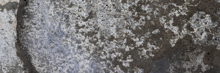 Texture of old cracked concrete wall. Rough gray concrete surface. Wide panoramic background for design.