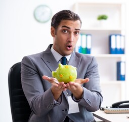 Young male accountant working in the office