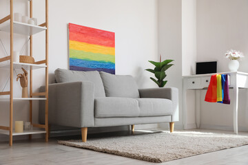 Interior of living room with workplace, LGBT flag and painting