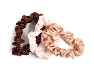 Different silk scrunchies isolated on white background