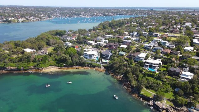 Aerial drone pullback reverse view of Cronulla Peninsula on the Port Hacking in the Sutherland Shire, Sydney NSW Australia looking toward Burraneer during summer on a sunny day