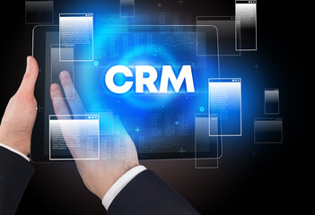 Close-up of a hand holding tablet