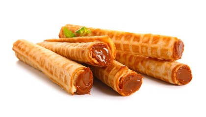 Delicious wafer rolls with boiled condensed milk and mint isolated on white background