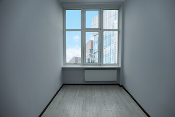 New empty room with clean windows and white walls