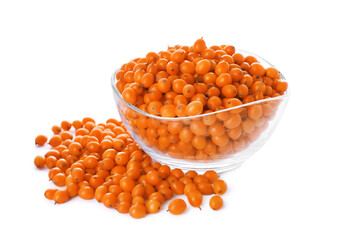 Fresh ripe sea buckthorn berries in glass bowl on white background