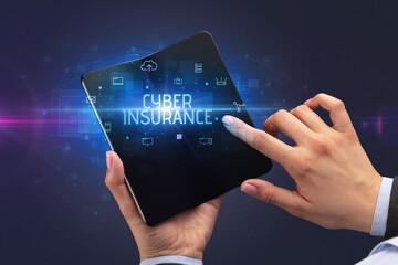 Businessman holding a foldable smartphone, security concept