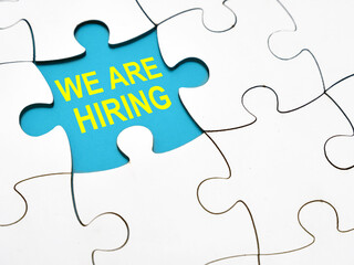 We are hiring, text words typography written under jigsaw puzzle, life and business motivational inspirational