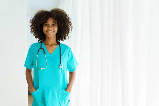 Beautiful American - African Black Ethnicity Female Doctor Standing In The Hospital Portrait With Copyspace. Surgery Female Doctor Portrait At Hospital.