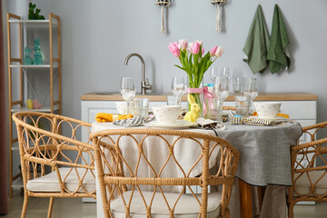 Interior of kitchen with table served for Easter celebration
