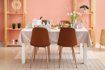 Interior of dining room with table served for Easter celebration