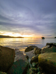 Outdoor scenery during sunset over the sea.
