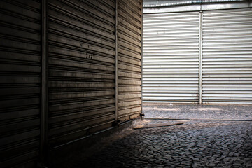 Metal roller shutter doors, in closed stores in popular shopping center in Brazil