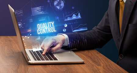 Businessman working on laptop, business concept