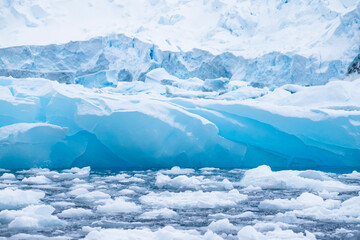 Fototapeta na wymiar View of icebergs, sea ice, and glacier ice in Antarctica