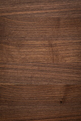 Dark tone walnut plank tabletop texture background. Wood planks desktop background.