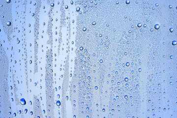 Naklejka na ściany i meble drops glass blue background abstract, transparent cold background water splashes