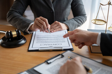 Lawyer, legal advisor, Asian businessman explaining agreement details Business contracts to investors and brainstorming Take notes for accuracy in the document before signing the contract together.