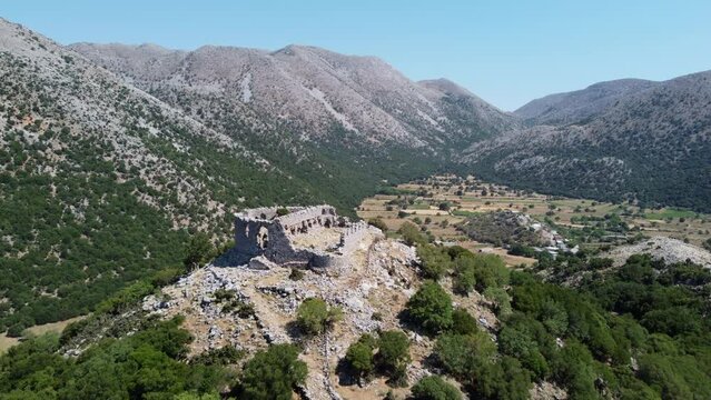 Aerial view over Turkish castle fortress ruins in the Leuka Ori mountains and Improu gorge, Askifou Crete