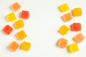 Pieces of fruit jelly on white