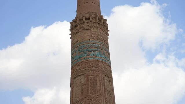Slow tilt up along famous brick pillar Minaret of Jam in Afghanistan
