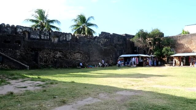 Old fort of Zanzibar with grassy courtyard houses local curiosity stores, Stone Town